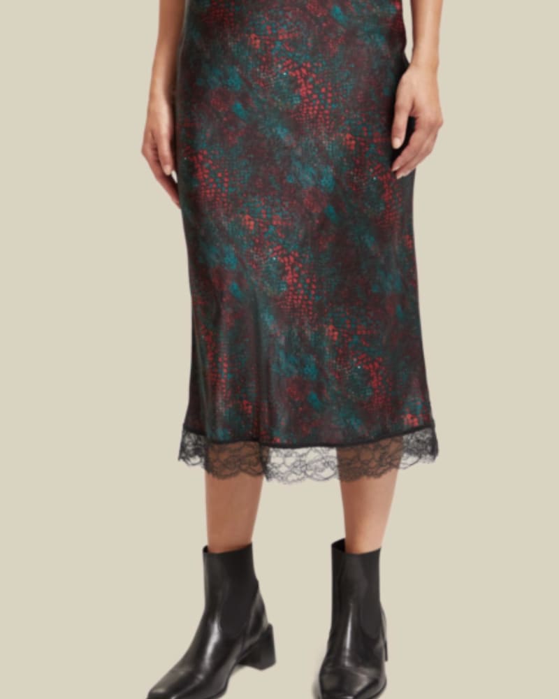 Front of a model wearing a size Large Satin Midi Skirt In Snake in Snake by SCOTCH & SODA. | dia_product_style_image_id:358342